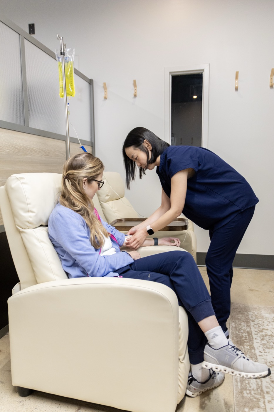 A clinician administering a vaccine to a patient in our clinic
